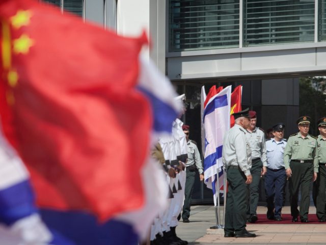 Gen. Chen Bingde, left, chief of the General Staff of the Chinese People's Liberation Army, third from right, and Israeli Chief of Staff Lt. Gen. Benny Gantz, fifth from right, review an honor guard during a welcoming ceremony in a military base in Tel Aviv, Sunday, Aug. 14, 2011. After …