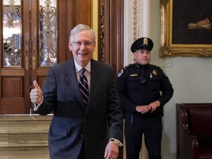 Senate Majority Leader Mitch McConnell (C), Republican-Kentucky, gives a thumbs up after US Vice President Mike Pence cast a tie-breaking vote, to confirm Betsy DeVos as US Secretary of Education, on Capitol Hill in Washington, DC, February 7, 2017. The US Senate confirmed billionaire heiress Betsy DeVos as the next …