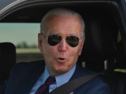 US President Joe Biden talks to the media after driving the new electric Ford F-150 Lightn