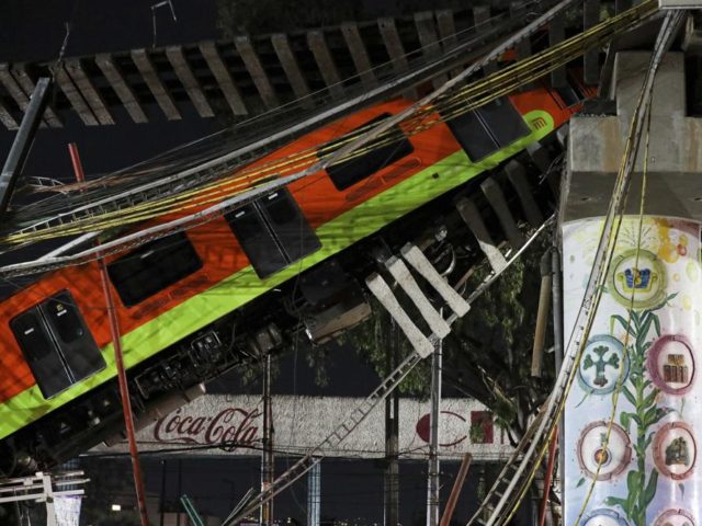 Mexico City's subway cars lay at an angle after a section of Line 12 of the subway collaps