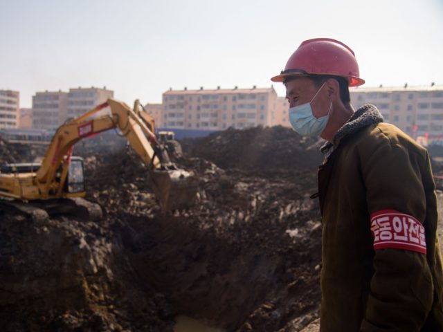 A worker at the construction site of a 10,000 apartment development in the Songsin and Songhwa area of Pyongyang on March 25, 2021. (Photo by KIM Won Jin / AFP) (Photo by KIM WON JIN/AFP via Getty Images)