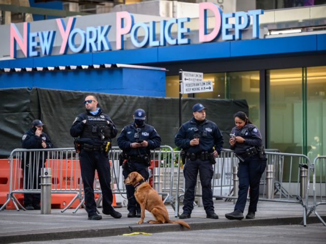 New York police department (NYPD) officers stand on Times Square in New York on May 9, 202