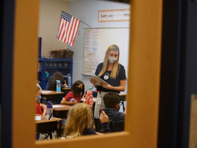 A teacher instructs students at Freedom Preparatory Academy on September 10, 2020 in Provo, Utah. - In person schooling with masks has started up in many Utah schools since shutting down in March of this year due to the covid-19 virus. (Photo by GEORGE FREY / AFP) (Photo by GEORGE …