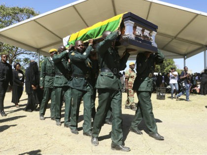 The coffin carrying the body of former Zimbabwean President Robert Mugabe is seen at during mass at his rural home in Zvimba, about 100 kilometers north west of the capital Harare, Saturday. Sept, 28, 2019. According to a family spokesperson Mugabe is expected to be buried at the residence after …