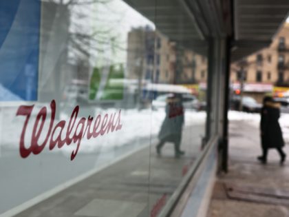 NEW YORK, NEW YORK - FEBRUARY 09: A Walgreens signage is seen on a storefront window in the Flatbush neighborhood of Brooklyn on February 09, 2021 in New York City. Uber and Walgreens announced today a partnership to offer free rides in communities of color to vaccination sites. the coronavirus …