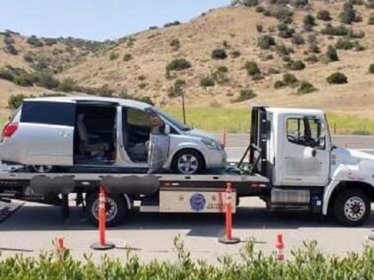 Border Patrol agents in the San Diego Sector arrested an armed human smugglers with migrants locked inside minivan on flatbed. (Photo: U.S. Border Patrol/San Diego Sector)