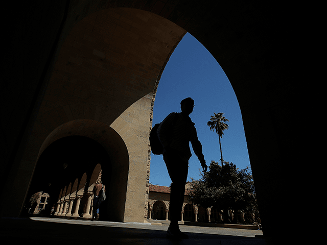 In this April 9, 2019, file photo, pedestrians walk on the campus at Stanford University i