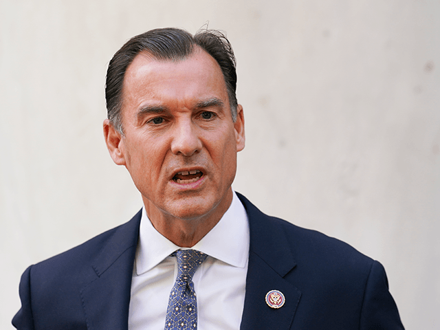 In this Aug. 18, 2020 file photo, U.S. Rep. Tom Suozzi, D-N.Y., addresses the media during a news conference, in the Queens borough of New York. Suozzi survived a tough challenge to win a third term representing a district that includes Long Island's wealthy north shore.. (AP Photo/John Minchillo, File)
