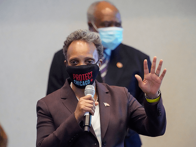 Chicago Mayor Lori Lightfoot speaks during a visit with Vice President Kamala Harris to a COVID-19 vaccination site Tuesday, April 6, 2021, in Chicago. The site is a partnership between the City of Chicago and the Chicago Federation of Labor. (AP Photo/Jacquelyn Martin)