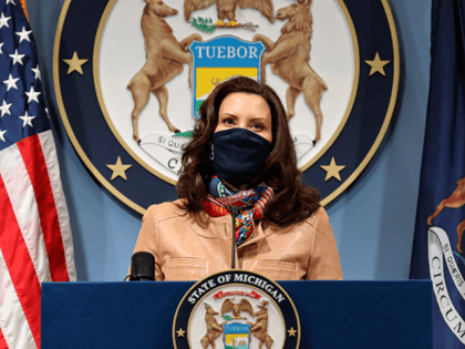 In this photo provided by the Michigan Office of the Governor, Gov. Gretchen Whitmer addresses the state during a speech in Lansing, Mich. Friday, April 9, 2021. Faced with the country's highest rate of new coronavirus infections, Whitmer on Friday urged a two-week suspension of in-person high school classes, all …