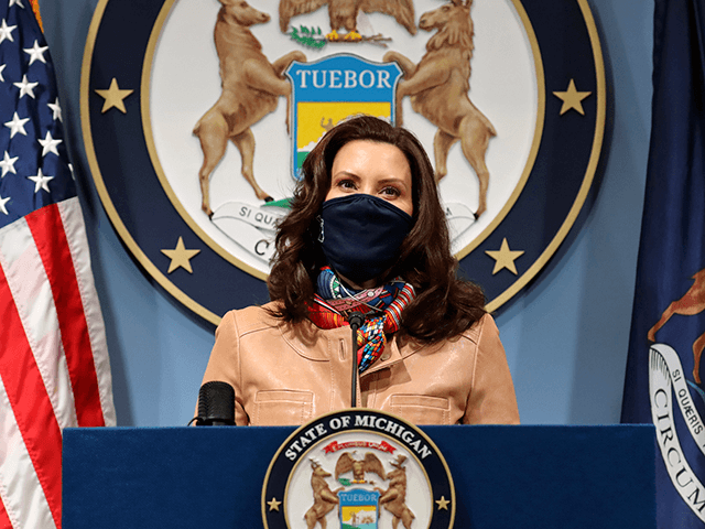 In this photo provided by the Michigan Office of the Governor, Gov. Gretchen Whitmer addre