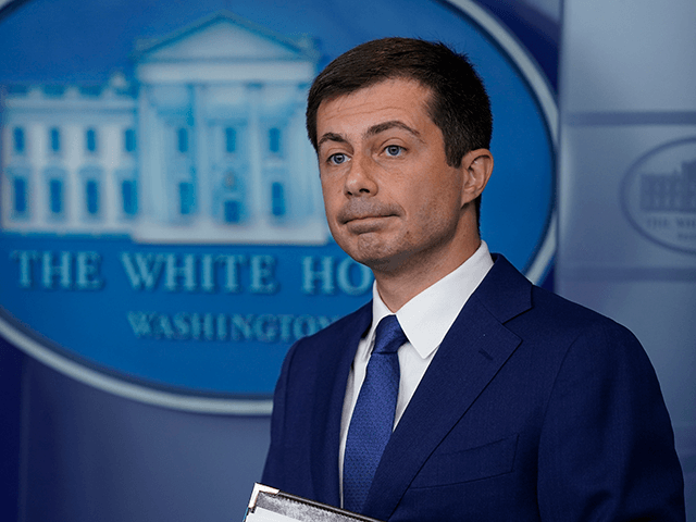 Secretary of Transportation Secretary Pete Buttigieg listens during a press briefing at the White House, Wednesday, May 12, 2021, in Washington. (AP Photo/Evan Vucci)