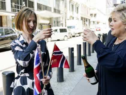 From left, Norway's Minister of Trade and Industry Iselin Nybo and Prime Minister Erna Solberg, toast, after a press conference on the status of free trade negotiations with the United Kingdom, in Oslo, Friday, June 4, 2021. Non-EU member Norway has reached a post-Brexit free trade deal with its greatest …