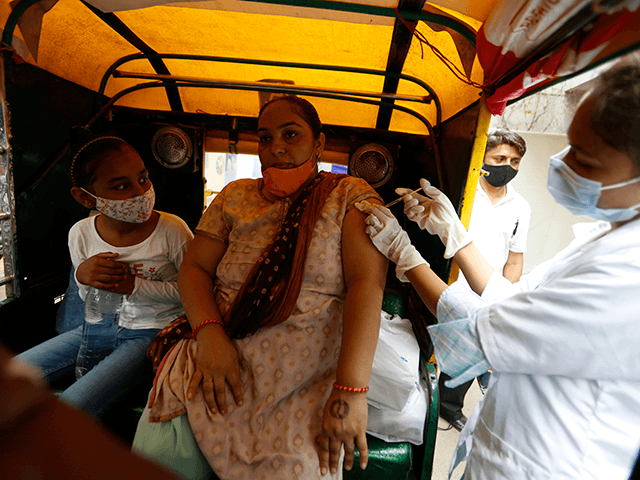 A physically disabled woman gets a dose of Covishield, Serum Institute of India's version