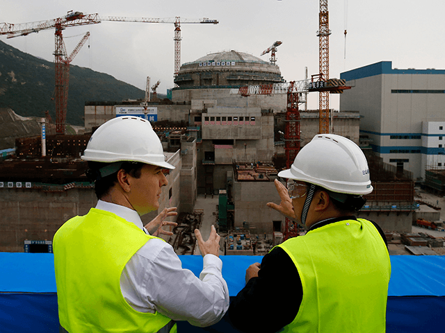 British Chancellor of the Exchequer George Osborne talks with Guo Liming of Taishan Nuclear Power Joint Venture Co Ltd (R) as he tours a nuclear reactor under construction at Taishan power plant on October 17, 2013 in Taishan, Guangdong province, China. Chancellor George Osborne has announced on the last day …