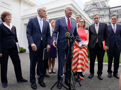 President Joe Biden, with a bipartisan group of senators, speaks Thursday June 24, 2021, outside the White House in Washington. Biden invited members of the group of 21 Republican and Democratic senators to discuss the infrastructure plan. From left are, Sen. Jeanne Shaheen, D-N.H., Sen. Rob Portman, R-Ohio, Sen. Bill …