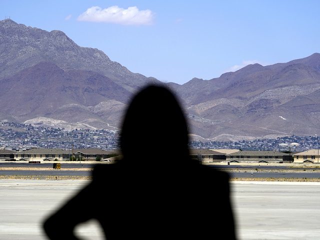 Vice President Kamala Harris stands in front of mountains during a press conference, Frida