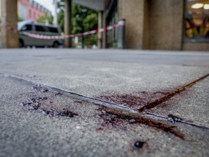 Blood is seen at the crime scene in central Wuerzburg, Germany, Saturday, June 26, 2021. G