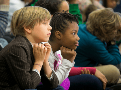 New York City school kids listen as Mayor-elect Bill de Blasio introduces the next schools