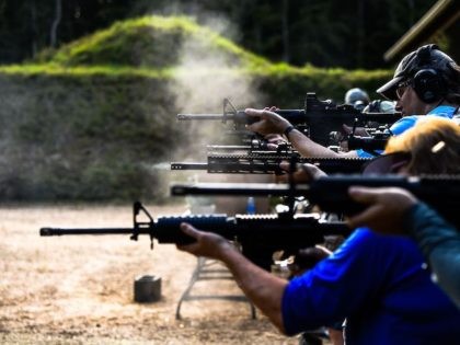 Students fire AR-15 semi-automatic rifles during a shooting course at Boondocks Firearms Academy in Jackson, Mississippi on September 26, 2020. - From the countryside to the cities, Americans are engaged in a frenzy of gun-buying fueled by the pandemic, protests and politics. (Photo by CHANDAN KHANNA / AFP) (Photo by …