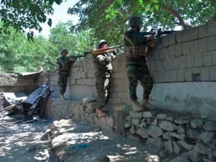 Members of Afghan security forces take their positions during an ongoing clash between Taliban and Afghan forces in Mihtarlam, the capital of Laghman Province on May 24, 2021, as the insurgents pressed on with their campaign to seize new territories as the US military continued with its troop pullout. (Photo …