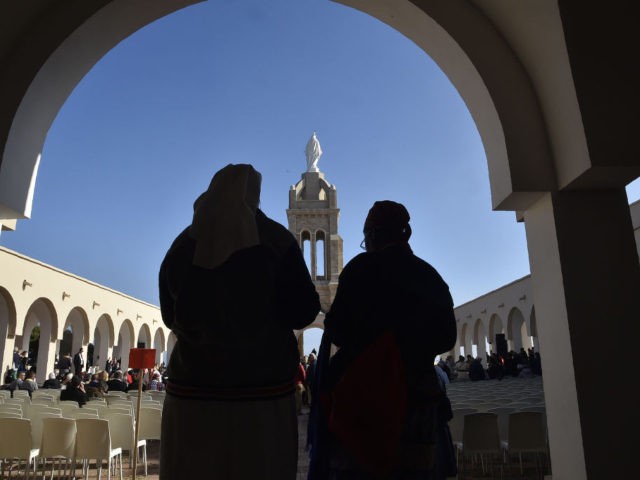 Nuns attend a ceremony at the Chapel of our Lady of Santa Cruz in Algeria's northern city of Oran, during which seven French monks and 12 other clergy killed during the country's civil war were beatified, on December 8, 2018. - Papal envoy Cardinal Angelo Becciu read the official decree …