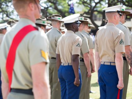 Australian Army soldiers and United States Marine Corps marines stand at attention during the Samichon Memorial Service on Exercise Rim of the Pacific 2016, Marine Corps Base Hawaii.