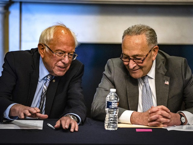 U.S. Senate Majority Leader Chuck Schumer (D-NY) and Committee Chairman Bernie Sanders (D-VT) holding a meeting with Senate Budget Committee Democrats in the Mansfield Room at the U.S. Capitol building on June 16, 2021 in Washington, DC. The Majority Leader and Democrats on the Senate Budget Committee are meeting to …