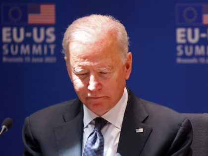 US President Joe Biden reads a document during an EU - US summit at the European Union headquarters in Brussels on June 15, 2021. (Photo by KENZO TRIBOUILLARD / AFP) (Photo by KENZO TRIBOUILLARD/AFP via Getty Images)