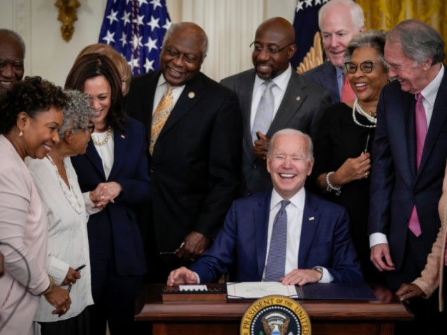 WASHINGTON, DC - JUNE 17: U.S. President Joe Biden signs the Juneteenth National Independence Day Act into law in the East Room of the White House on June 17, 2021 in Washington, DC. The Juneteenth holiday marks the end of slavery in the United States and the Juneteenth National Independence …