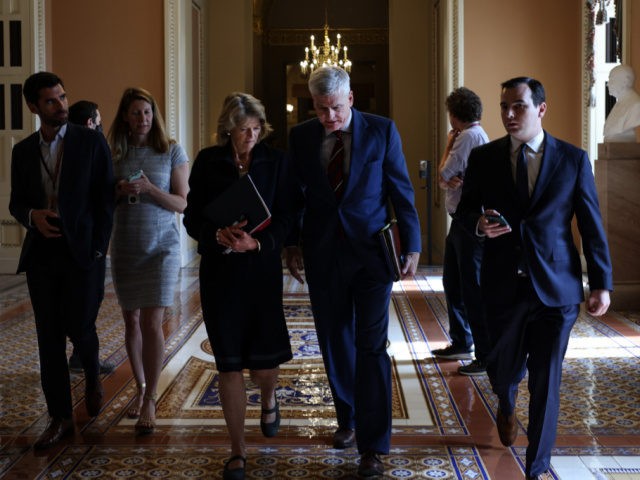 WASHINGTON, DC - JUNE 09: Sen. Lisa Murkowski (R-AK) (L) and Sen. Bill Cassidy (R-LA) (R) leave the office of Senate Minority Leader Mitch McConnell (R-KY) following a meeting on Capitol Hill on June 09, 2021 in Washington, DC. Since the talks on infrastructure legislation with the White House fell …