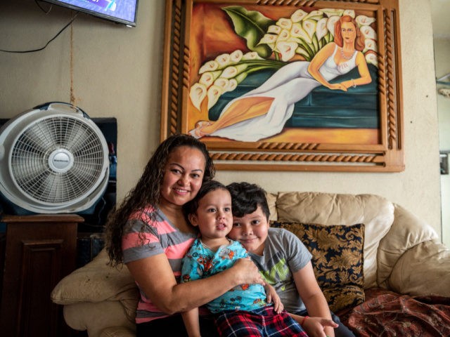 Alma Beatriz Serrano Ramirez (L) poses for a photo with her sons Adriel and Kennet at her home in Matamoros, Mexico on May 25, 2021. - Alma, a migrant from Honduras, would teach a weekend school at the migrant camp but after it was closed, the teachers wanting to continue …