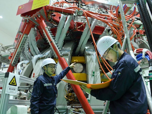 Technical personnel checks the Chinas HL-2M nuclear fusion device, known as the new generation of "artificial sun", at a research laboratory in Chengdu, in eastern China's Sichuan province on December 4, 2020. - China successfully powered its "artificial sun" nuclear fusion reactor for the first time, state media reported on …