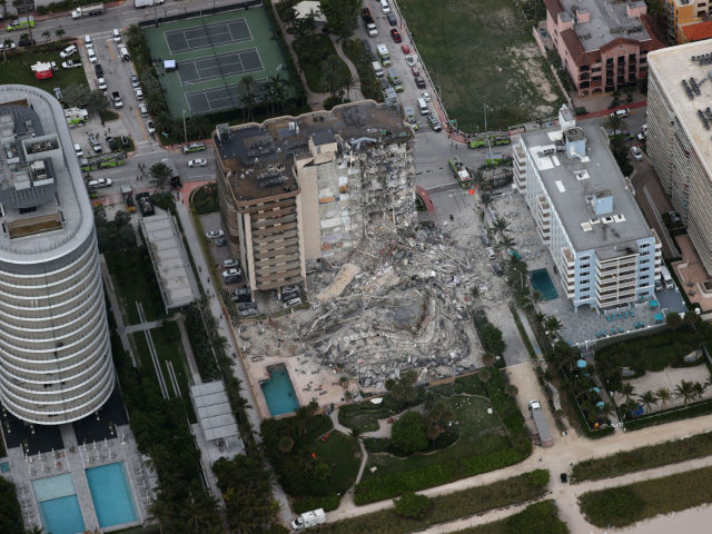 SURFSIDE, FLORIDA - JUNE 24: Search and rescue personnel work in the rubble of the 12-story condo tower that crumbled to the ground after a partial collapse of the building on June 24, 2021 in Surfside, Florida. It is unknown at this time how many people were injured as search-and-rescue …