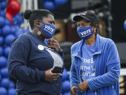 Supporters of Democratic Senate candidates Jon Ossoff and Raphael Warnock (D-GA) attend a get out to vote rally in Hampton, Georgia on January 2, 2021. - Just days ahead of a pair of crucial runoff elections in Georgia, Senator David Perdue is locked in a tight race with Democratic challenger …