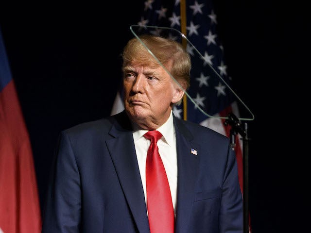 GREENVILLE, NC - JUNE 05: Former U.S. President Donald Trump listens to Ted Budd announce he's running for the NC Senate at the NCGOP state convention on June 5, 2021 in Greenville, North Carolina. The event is one of former U.S. President Donald Trumps first high-profile public appearances since leaving …