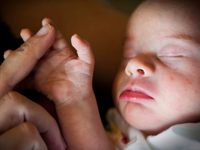 Five week old Oliver van Vuuren and his mother Lynn van Vuuren on March 20, 2012 in Pretoria, South Africa. March 21, 2012 marks the 7th anniversary of World Down Syndrome Day and for the first time the day will be officially observed by the United Nations. (Photo by Foto24/Gallo …