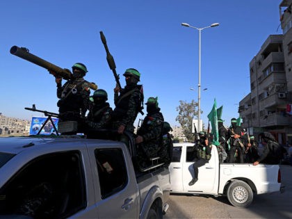 Members of the Ezzedine al-Qassam Brigades, the armed wing of the Palestinian Hamas movement, parade in Gaza City on june 7, 2021. (Photo by MOHAMMED ABED / AFP) (Photo by MOHAMMED ABED/AFP via Getty Images)