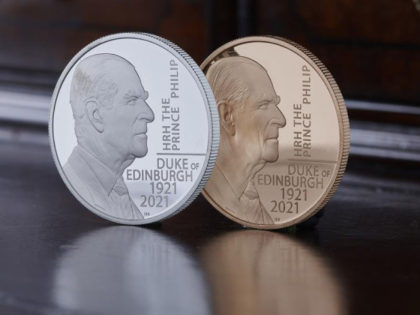 This undated photo issued by HM Treasury shows the silver and gold coins commemorating the life of Prince Philip, the Duke of Edinburgh, unveiled by Chancellor Rishi Sunak on Saturday June 26, 2021. The special edition 5 pound coin features an original portrait of the Duke and the coin's design …