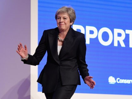 BIRMINGHAM, ENGLAND - OCTOBER 03: British Prime Minister Theresa May dances as she walks out onto the stage to deliver her leader's speech during the final day of the Conservative Party Conference at The International Convention Centre on October 3, 2018 in Birmingham, England. Theresa May delivered her leader's speech …