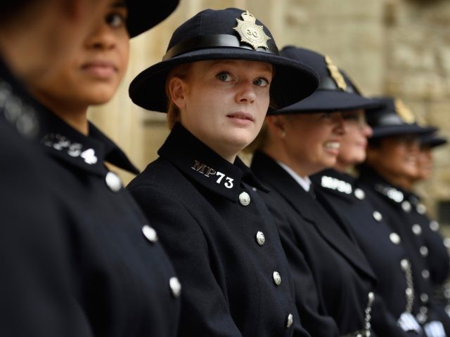 LONDON, ENGLAND - MAY 17: Serving police officers from the Metropolitan Police wear tradit