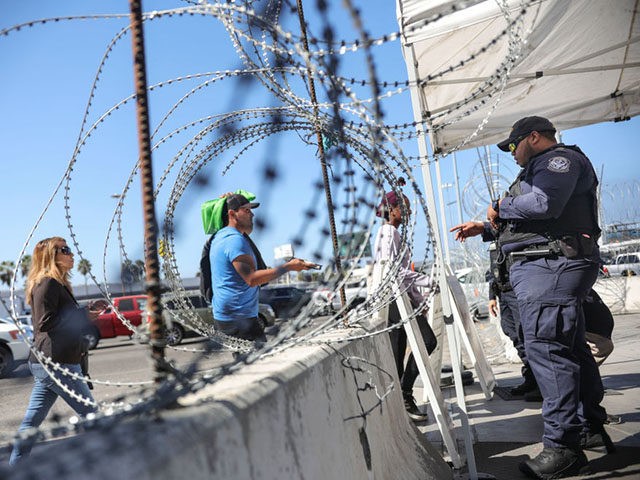 An Immigration and Customs Enforcement (ICE) agents check pedestrians' documentation at the San Ysidro Port of Entry on October 2, 2019 in San Ysidro, California. - Fentanyl, a powerful painkiller approved by the US Food and Drug Administration for a range of conditions, has been central to the American opioid …