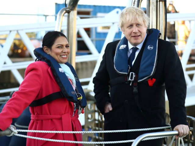 SOUTHAMPTON, ENGLAND - DECEMBER 2: Britain's Prime Minister Boris Johnson and Home Secretary, Priti Patel onboard a security vessel at the Port of Southampton, Britain December 2, 2019. (Photo by Hannah McKay - WPA Pool/Getty Images)