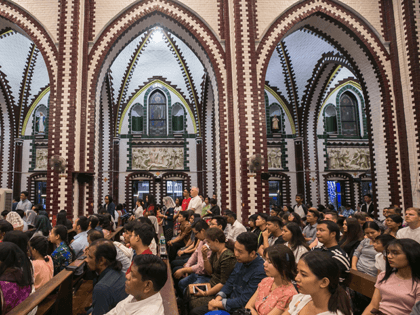 This picture taken on December 24, 2019 shows people attending a Christmas eve church service at St. Mary's Cathedral in Yangon. (Photo by Sai Aung Main / AFP) (Photo by SAI AUNG MAIN/AFP via Getty Images)