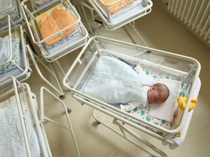 UNDISCLOSED, GERMANY - AUGUST 12: A 4-day-old newborn baby, who has been placed among empty baby beds by the photographer, lies in a baby bed in the maternity ward of a hospital (a spokesperson for the hospital asked that the hospital not be named) on August 12, 2011 in a …