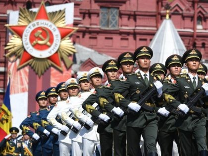 MOSCOW, RUSSIA - JUNE 24: Servicemen of the Chinese Armed Forces march during a Victory Day military parade in Red Square marking the 75th anniversary of the victory in World War II, on June 24, 2020 in Moscow, Russia. The 75th-anniversary marks the end of the Great Patriotic War when …