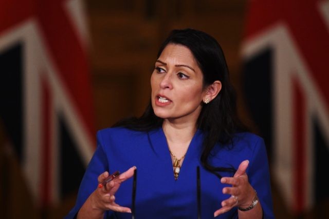 LONDON, ENGLAND - JANUARY 12: United Kingdom Home Secretary Priti Patel talks at a coronavirus press conference at Downing Street on January 12, 2021 in London, England. The Home Secretary pressed the message that the nation must abide by the government's rules to help get Covid-19 cases down again, following …