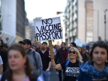 TOPSHOT - Demonstrators take part in an anti-lockdown, anti-Covid-19 vaccination passports, 'Unite for Freedom' protest in central London on April 24, 2021. (Photo by Ben STANSALL / AFP) (Photo by BEN STANSALL/AFP via Getty Images)
