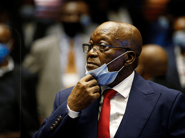 Former South African President Jacob Zuma stands in the dock during recess of his corruption trial at the Pietermaritzburg High Court in Pietermaritzburg, South Africa, on May 26, 2021. - Jacob Zuma faces 16 charges of fraud, graft and racketeering relating to a 1999 purchase of fighter jets, patrol boats …