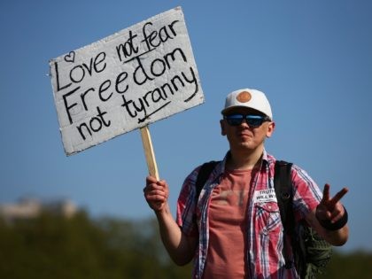 LONDON, ENGLAND - MAY 29: A demonstrator poses with a placard in Hyde Park after a "United